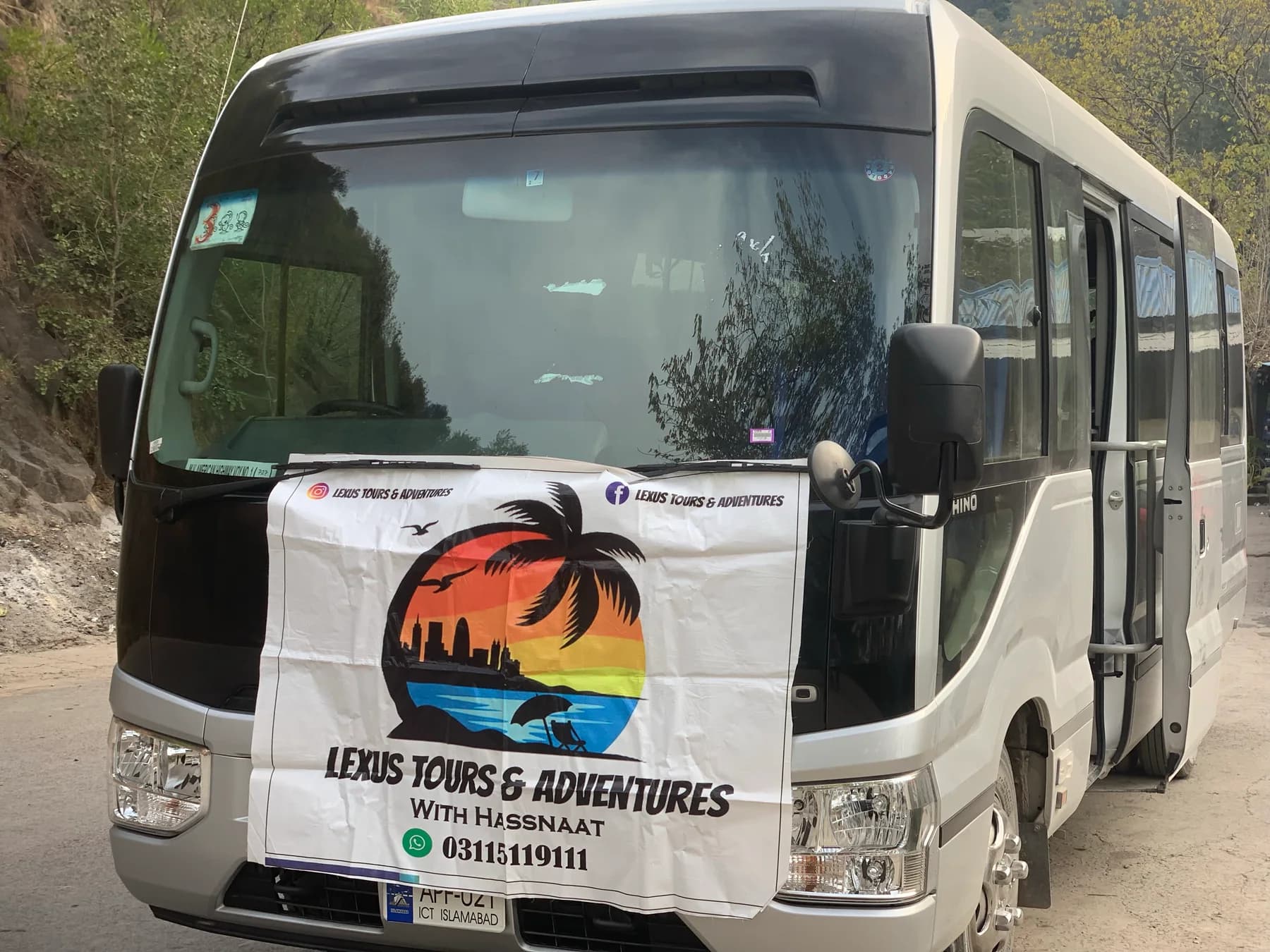 Lexuz Tours banner displayed beside a coach