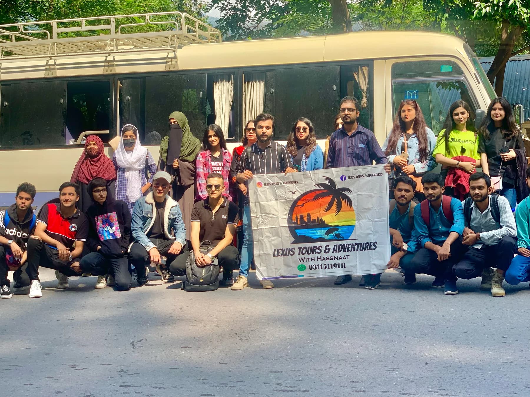 Lexuz Tours travellers gathered beside a coaster
